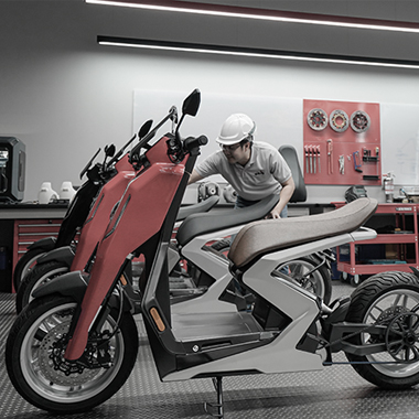 Engineer assembling an R-Series scooter in the workshop