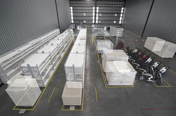 Row of R-Series scooters lined up in the warehouse